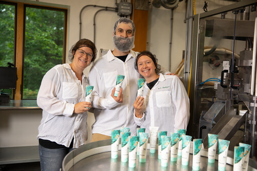 Badger employees holding new skin care products
