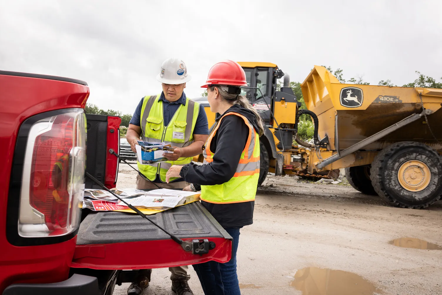 Construction workers looking over build plans