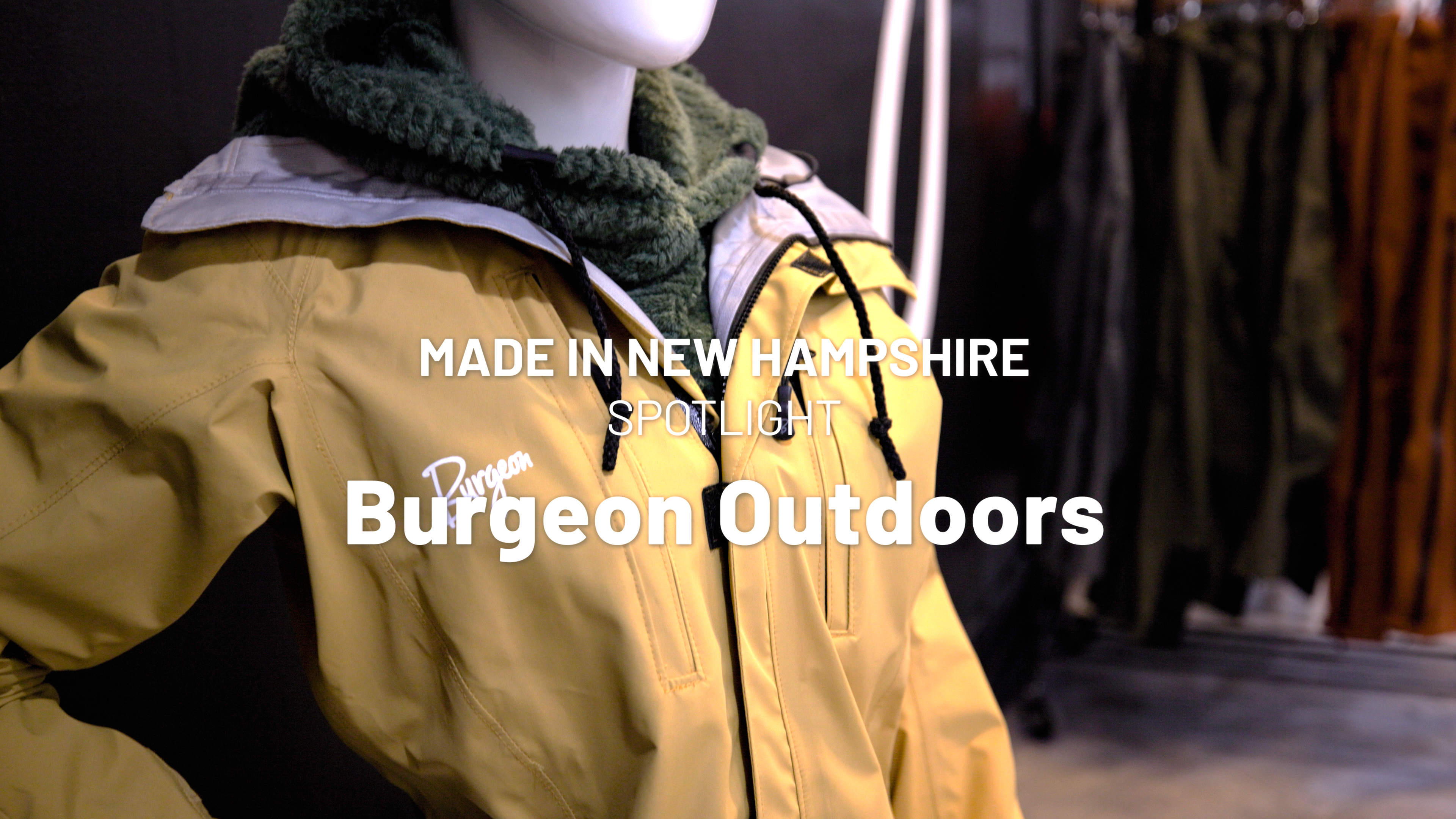 Yellow jacket with words over it Made in New Hampshire spotlight Burgeon Outdoors