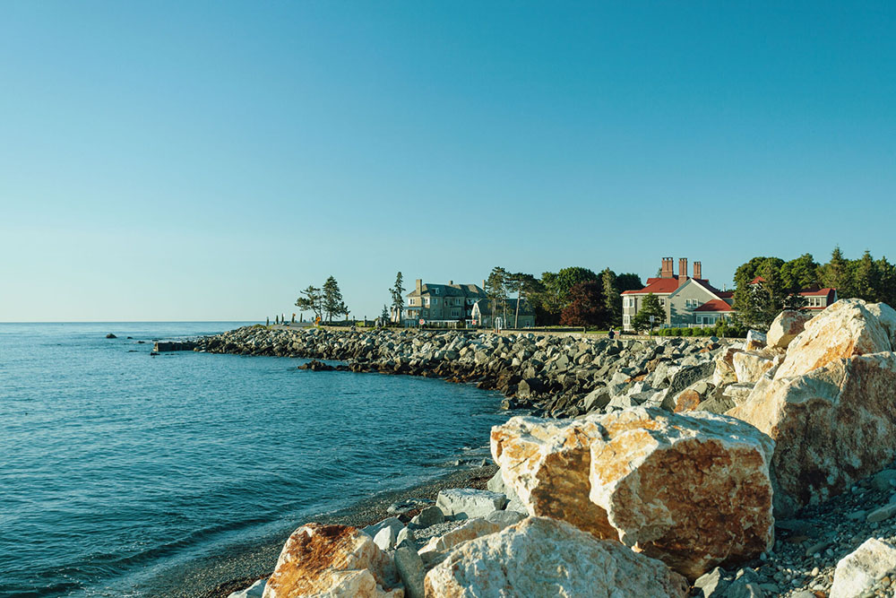 a view of the NH coast from a roadway cutting along the shoreline.