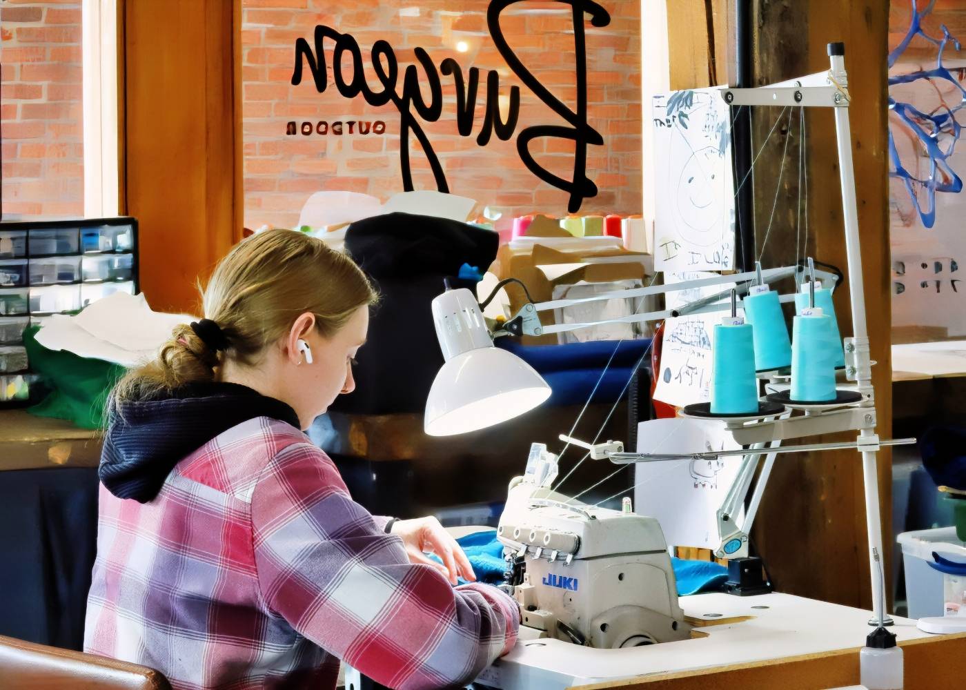 Woman sewing something blue