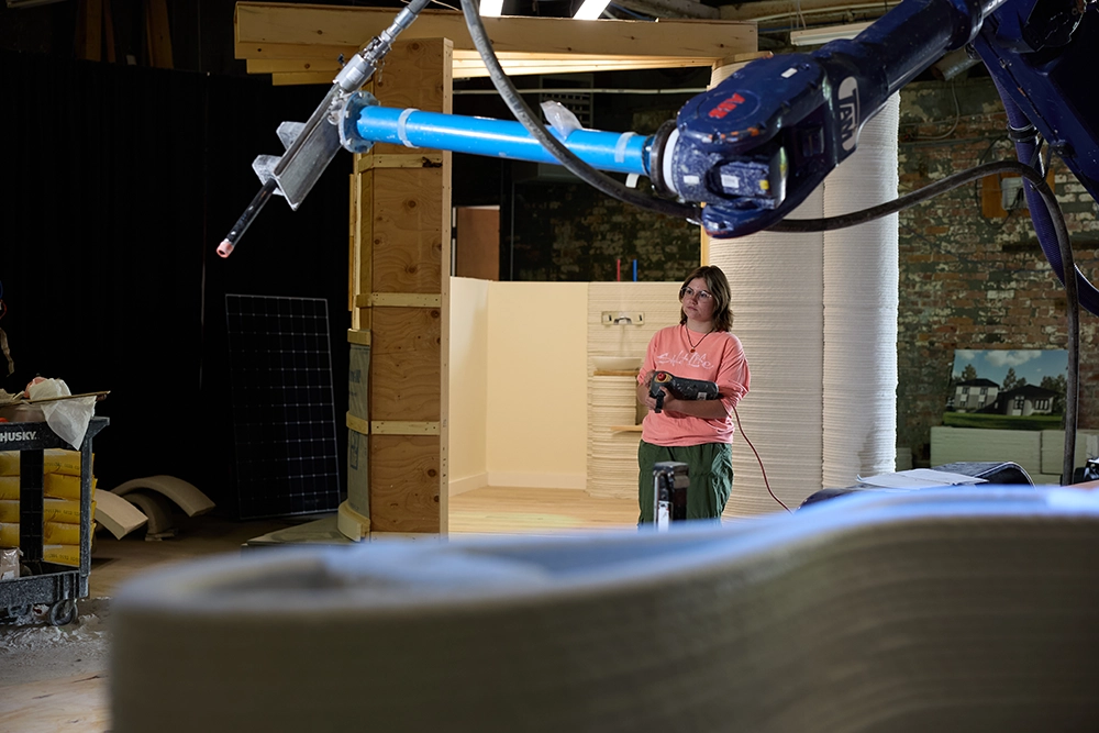 A woman operating a machine in a warehouse