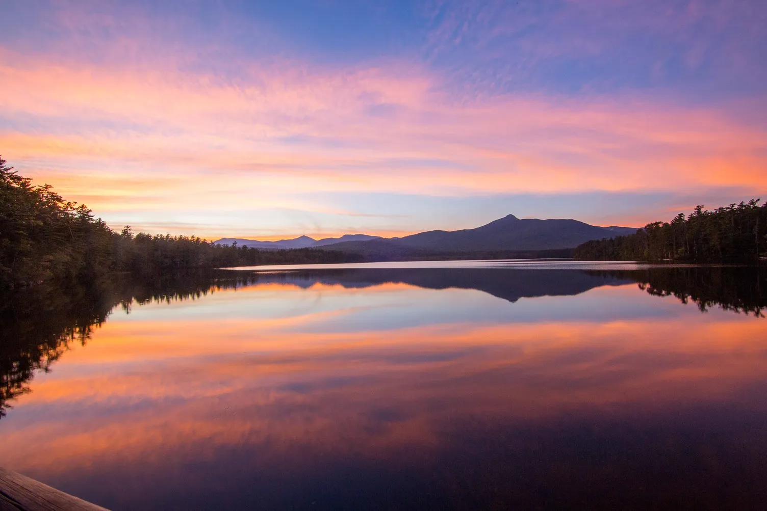 A view of a lake at sunset