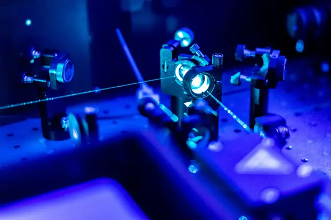 A close up of a machine with a blue light