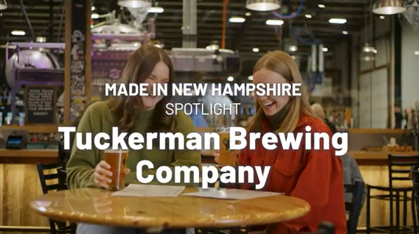 two woman at a table with beers with the words "Tuckerman Brewing Company" overlaying the image.