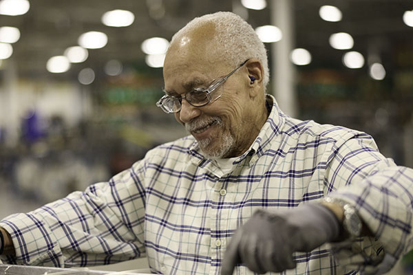A man working in a mechanical setting.