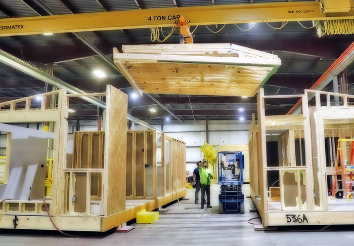 a view of a wooden structure being built inside a warehouse