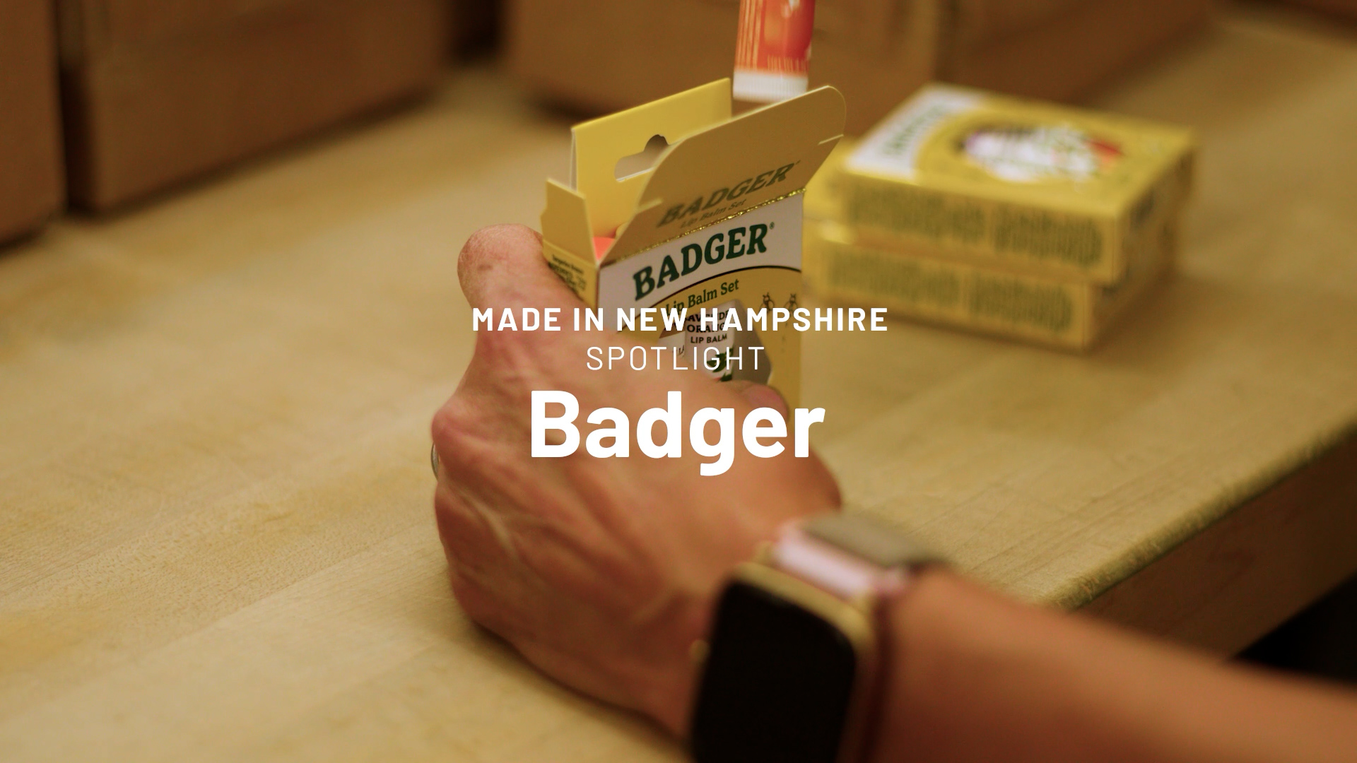 Image of a person putting a chapstick into a Badger 