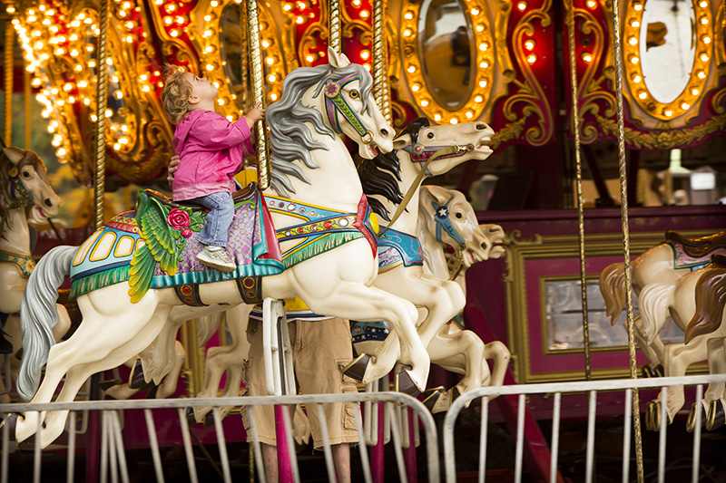 a girl on a carousel