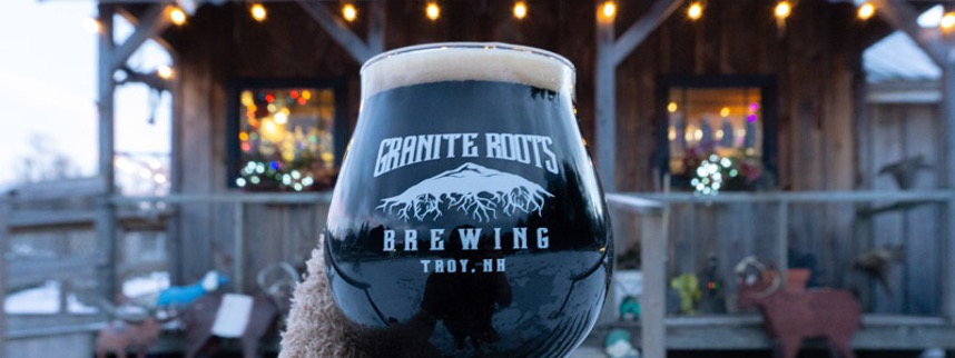 Up close image of a beer with a blurred background at Granite Roots Brewing