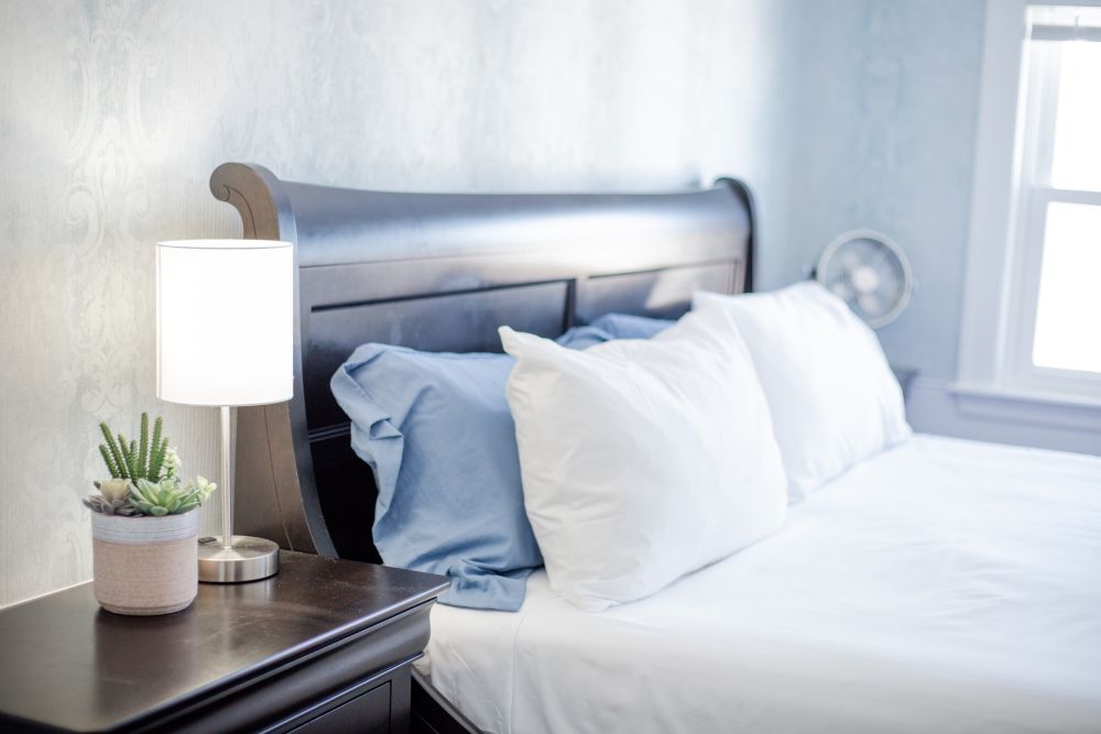 An example of a cozy bed in a guest room at The Blue Bear Inn.