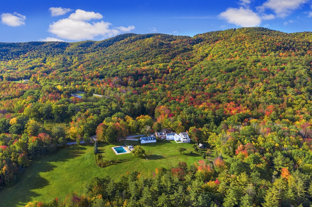 Aerial view of the Blue Bear Inn nestled in the fall foliage of Southern New Hampshire.