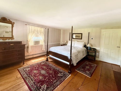 Baker Room features a four poster queen bed and private bath