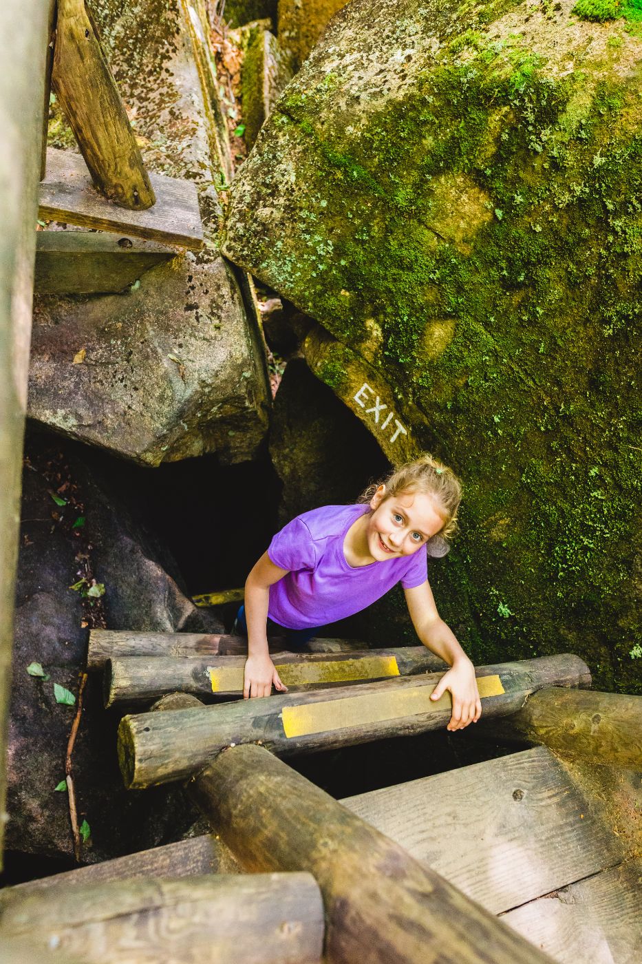 Exiting a boulder cave