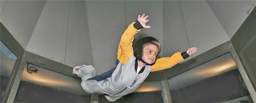 Young child indoor sky diving at SkyVenture