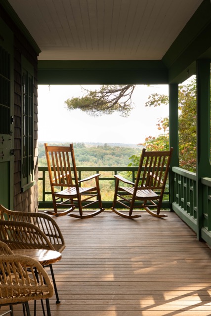 The porch of the Lodge with views of the Belknap Range