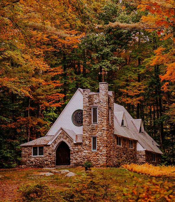 a stone cottage in the woods 